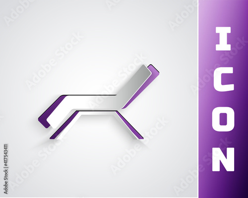 Paper cut Sunbed icon isolated on grey background. Sun lounger. Paper art style. Vector.