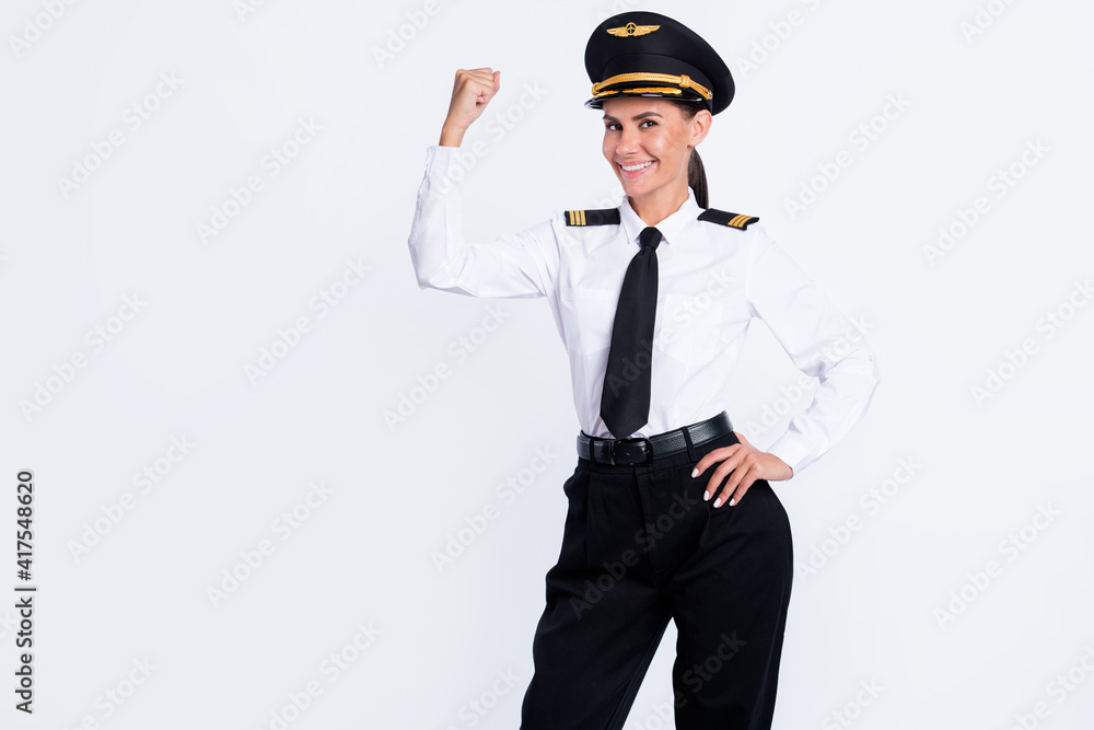 Portrait of attractive proud cheerful pilot girl showing biceps cool good success win winner isolated over white color background Portrait of attractive proud cheerful pilot girl showing biceps cool good success win winner isolated over white color background