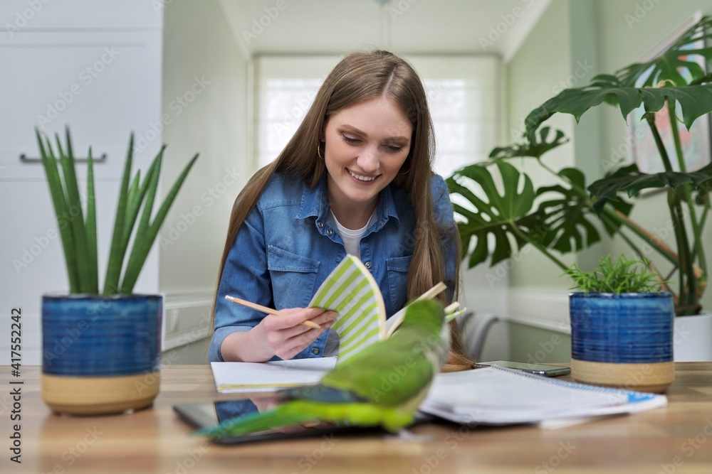 Young female university student studying online using video communication Young female university student studying online using video communication