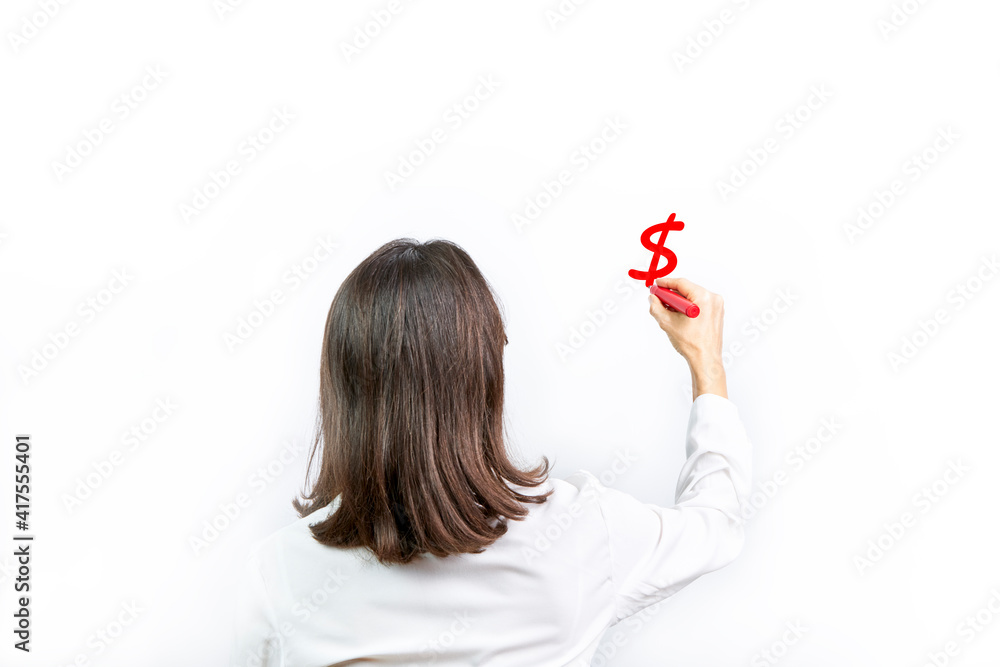 Executive woman writing the dollar sign, $. Economic concept Executive woman writing the dollar sign, $. Economic concept