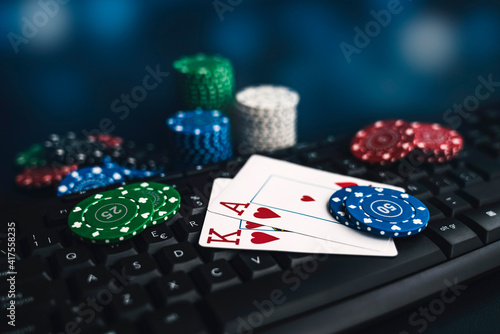 gambling online bet, table with keyboard, cards and poker chips