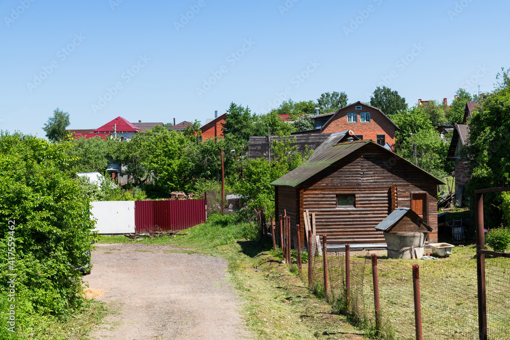 Fragment of village with brick and wooden houses. Russia Fragment of village with brick and wooden houses. Russia