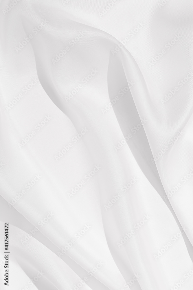 Cloth texture background white colors. Bright satin fabric with creases on fabric close up. Cloth texture background white colors. Bright satin fabric with creases on fabric close up.