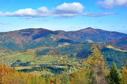 Mountain view with meadow and colorful autumn trees  Gorce mountains  Poland