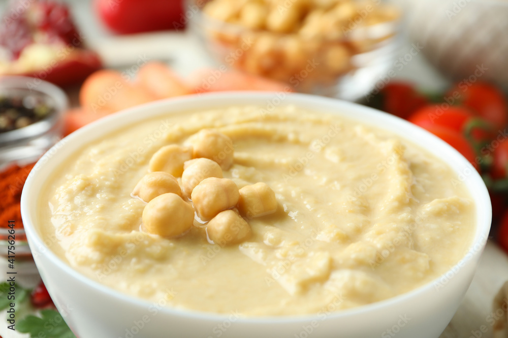 Bowl of tasty hummus, close up and space for text Bowl of tasty hummus, close up and space for text