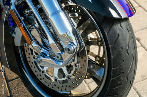 Close up and selective focus motorbike wheel and break detail