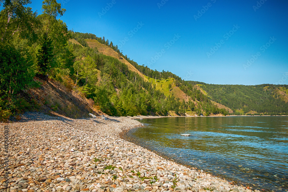 Fototapeta premium Beautiful natural summer landscape. Mountains, sky, water. Lake Baikal.