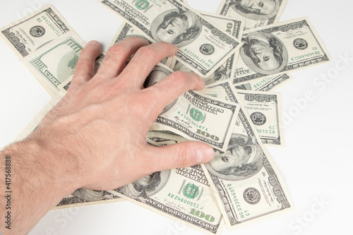Greed corruption. Hand with money on a white background
