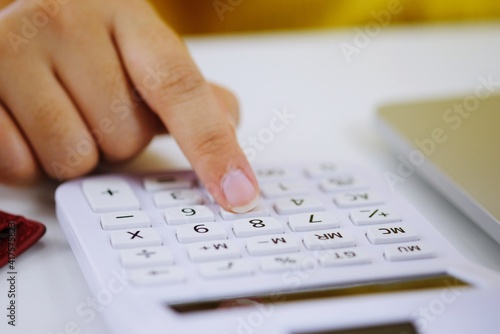 Woman Entrepreneur Calculating Cost Economic budget saving and investment concept.