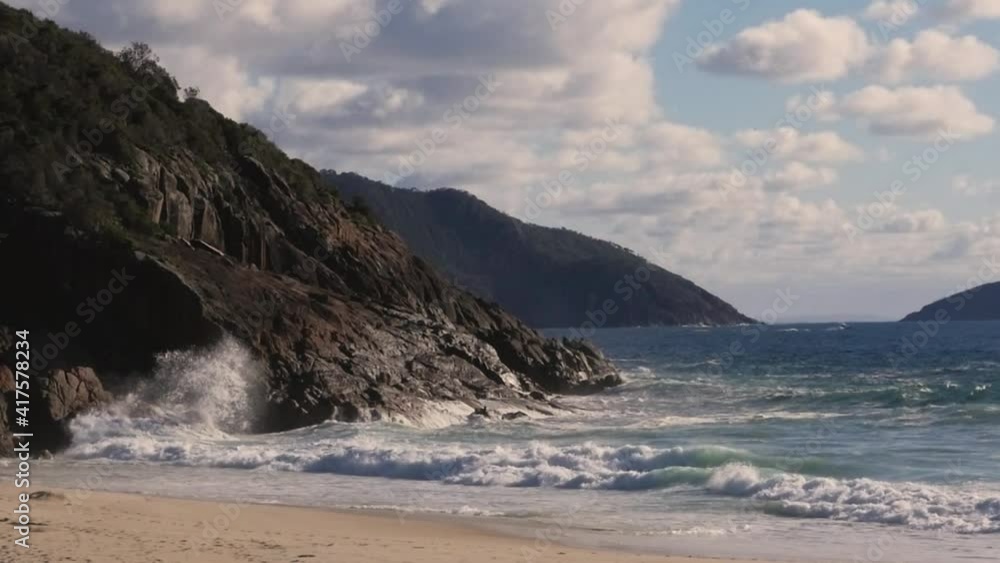 Slow-motion shot of ocean waves crashing against rocks on beach in Newcastle Port Stephens NSW Australia 1920x1080 HD Slow-motion shot of ocean waves crashing against rocks on beach in Newcastle Port Stephens NSW Australia 1920x1080 HD
