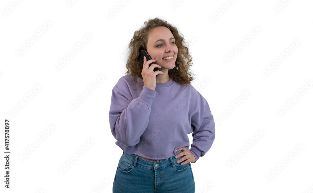 Young woman talking on the phone while she looks aside on white background. Young woman talking on the phone while she looks aside on white background.