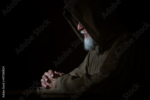 Monk prays in the Middle Ages