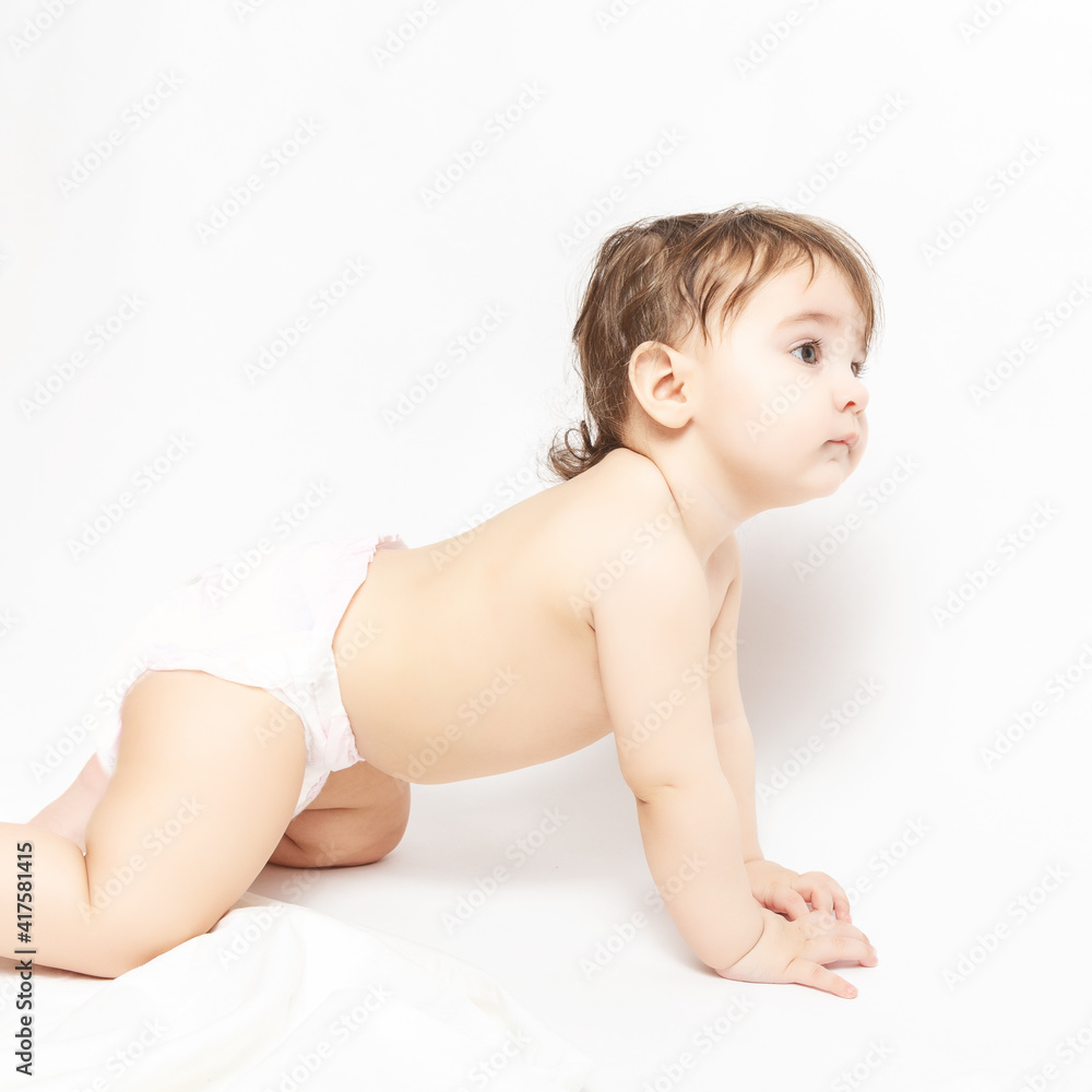 Portrait of a cute baby 9 months crawling on the floor. Portrait of a cute baby 9 months crawling on the floor.