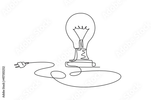 One single line drawing of light bulb on the floor with long wire. Inspiration idea creativity icon concept from glass bulb. Trendy continuous line draw design vector illustration