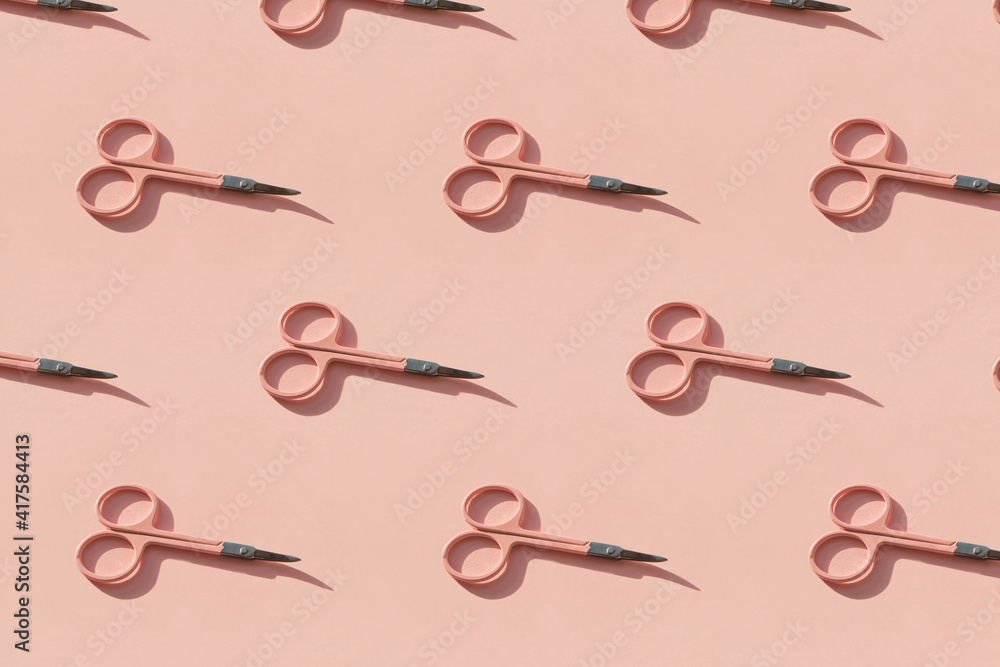 Cosmetic scissors on pink background. Cosmetic scissors on pink background.
