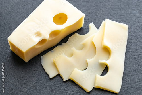 Obraz na płótnie Gouda cheese on gray background. Gouda cheese slices w salonie