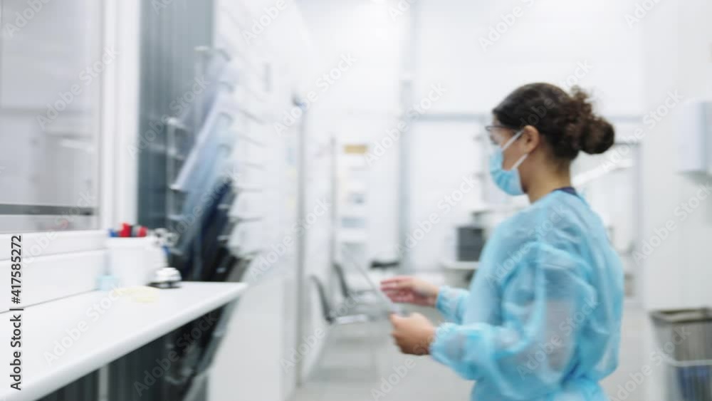 Doctors In Face Masks Checking Paperwork Doctors In Face Masks Checking Paperwork