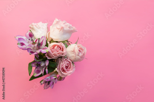 Fototapeta Naklejka Na Ścianę i Meble -  a bouquet of beautiful flowers on a pink background copy the space. the concept of spring, holiday and beauty