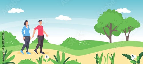 Couple walking together in the park. Man and woman romantic spring leisure time.