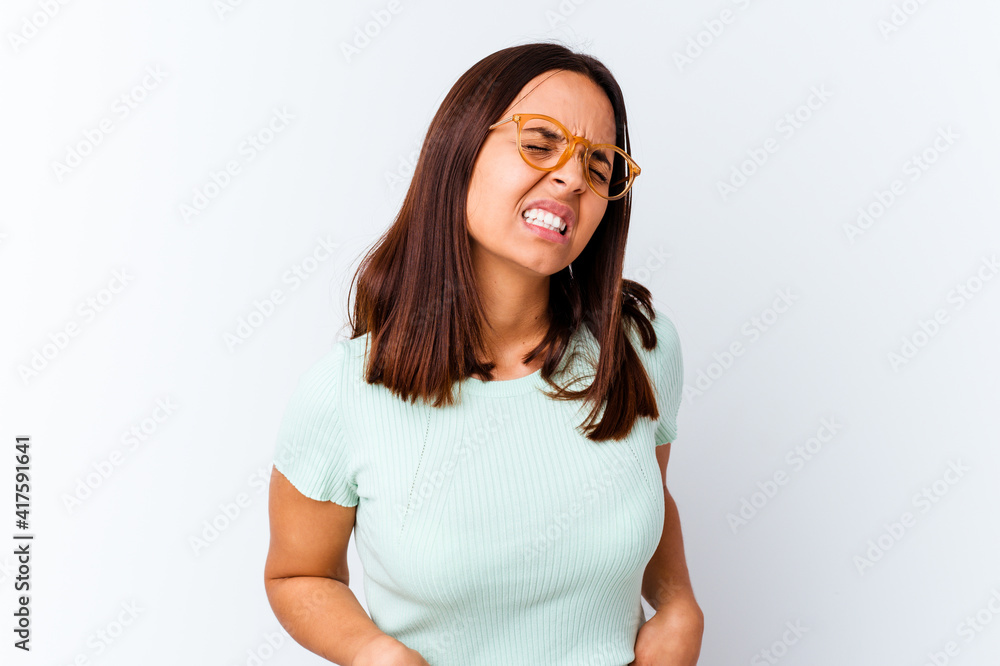 Young mixed race woman isolated suffering a back pain. Young mixed race woman isolated suffering a back pain.