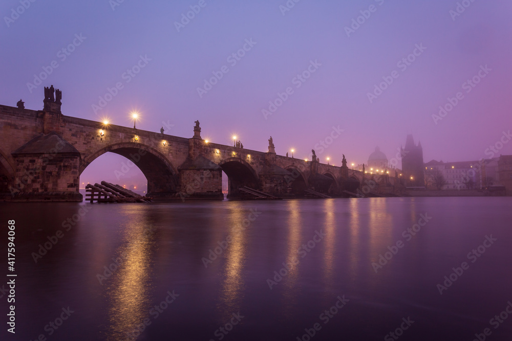 Beautiful view on Charles Bridge in Prague, Europe. Famous monument in sunrise time.