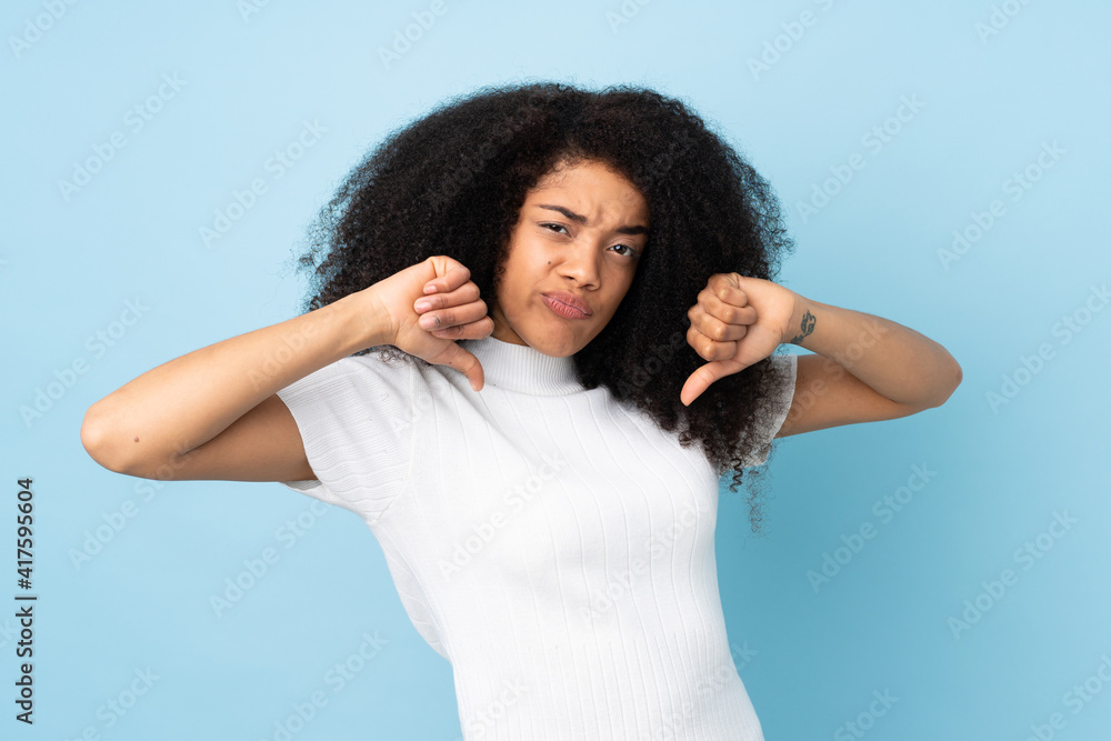 Young african american woman over isolated background proud and self-satisfied Young african american woman over isolated background proud and self-satisfied
