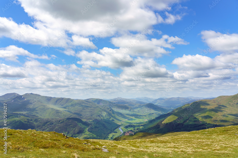 Looking down to Glen Lyon from the mountain summit of Meall na Aighean in the Scottish Higlands, UK landscape.