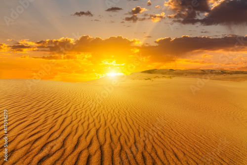 Beautiful sunset over the sand dunes in the Arabian Empty Quarter Desert  UAE. Rub  al Khali