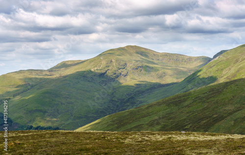 The mountain summit of Carn Gorm and crags of Creag Ghlas above Glen Lyon in the Scottish Highlands, UK landscapes.