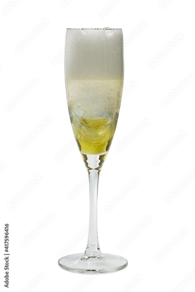A Prosecco wine glass with gold-colored liqueur and ice.Isolated on a white background A Prosecco wine glass with gold-colored liqueur and ice.Isolated on a white background