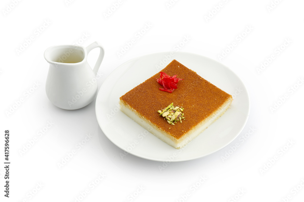 Turkish dessert kunefe, kunafa, kadayif with pistachio powder and