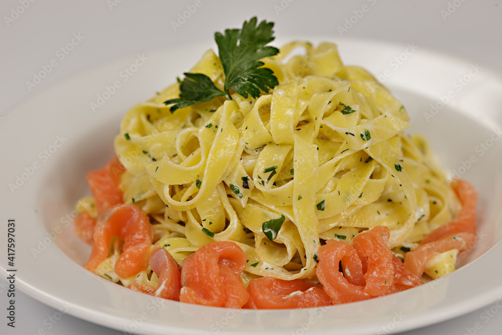 traditional italian pasta with salmon slices