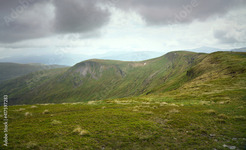 The mountain summit of Meall a Phuill from Meall Buidhe above Loch Daimh in the Scottish Highlands, UK landscapes.