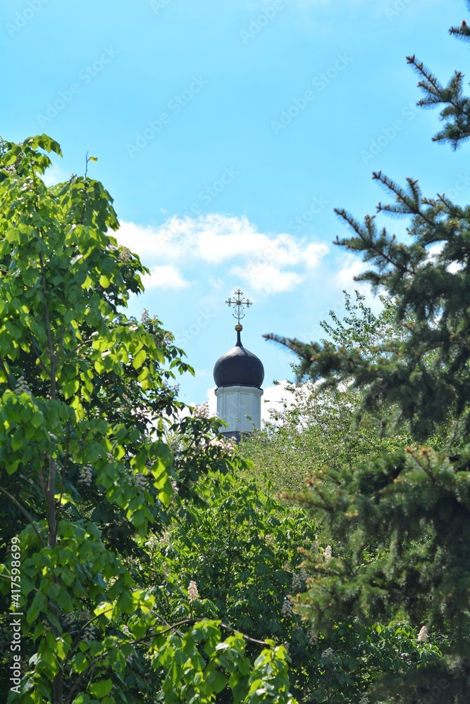 the dome of the church with a cross rises into the sky the dome of the church with a cross rises into the sky