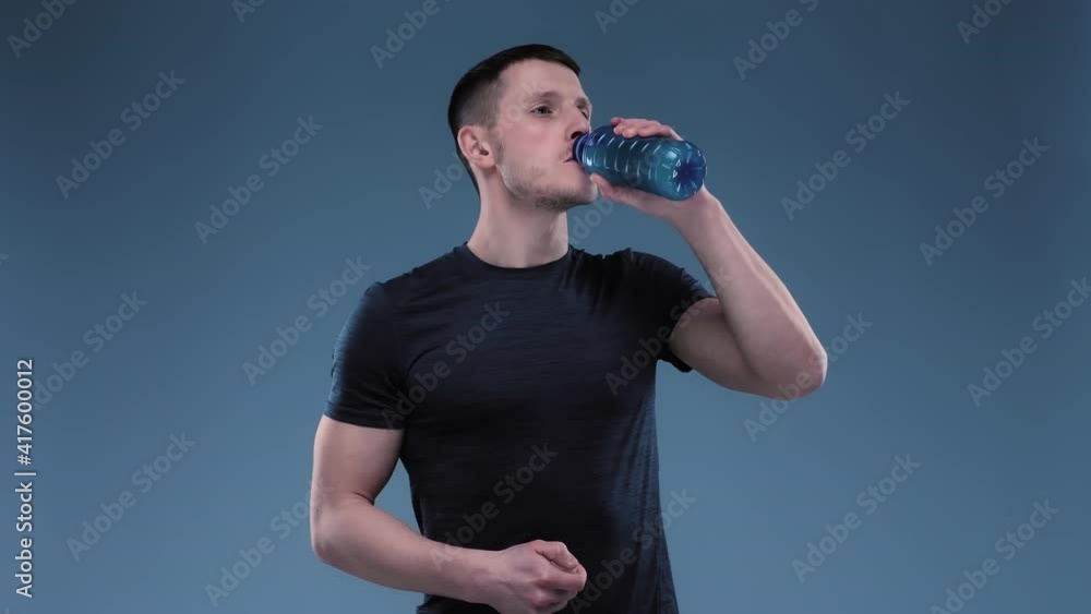 Sportsman Drinking Sport Drink. Man Drinking BCA Before Traning. Man