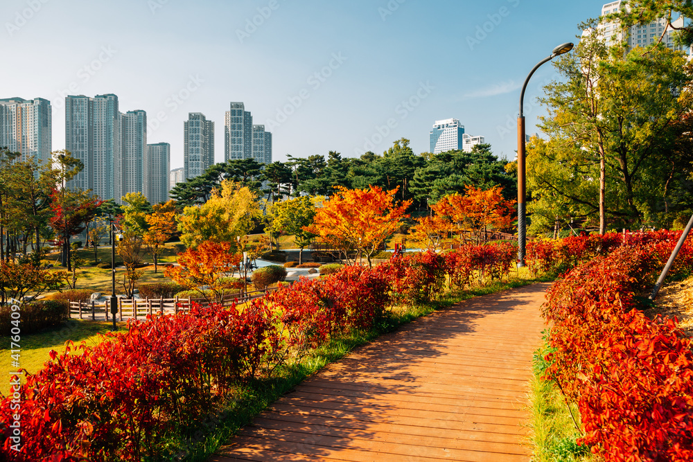Modern skyscrapers and Gwanggyo Lake Park at autumn in Suwon, Korea
