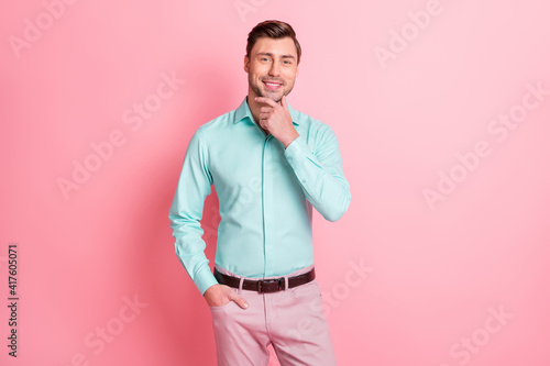 Photo portrait of young entrepreneur smiling confident touching face thoughtful isolated on pastel pink color background © deagreez