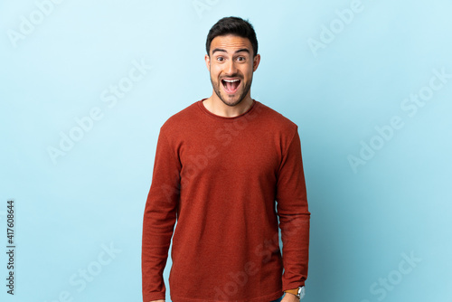 Young handsome man over isolated background with surprise facial expression