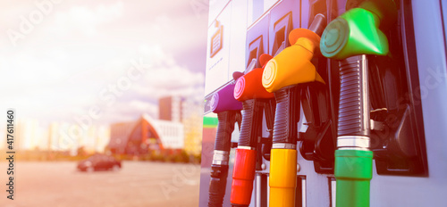 Wallpaper Mural Gas station for a car. Column with fuel pistols close-up with lights effects. Long banner with white background. Torontodigital.ca