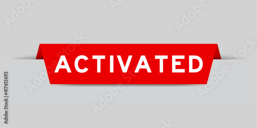 Red color inserted label with word activated on gray background