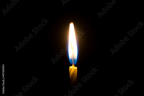 flames burning in the dark candle. close-up