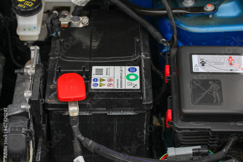 Battery in car engine bay