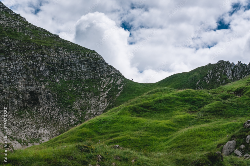 Alpine landscape with mountain-climber Alpine landscape with mountain-climber