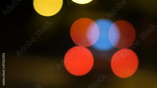 Abstract background of city lights bokeh. Blurred city lights . Defocused blurred lights. City at night . Traffic light. Traffic light bokeh. City bokeh night light .