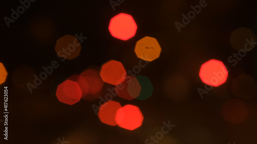 Abstract background of city lights bokeh. Blurred city lights . Defocused blurred lights. City at night . Traffic light. Traffic light bokeh. City bokeh night light . © Red