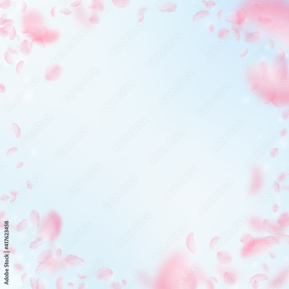 Sakura petals falling down. Romantic pink flowers vignette. Flying petals on blue sky square backgro