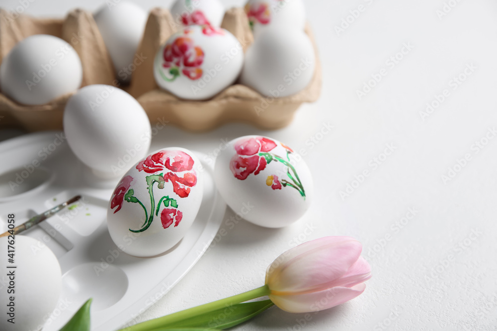 Painting Easter eggs on white table, space for text Painting Easter eggs on white table, space for text