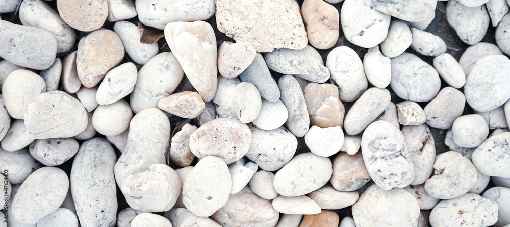 White bebbles stone or river stone background with vintage filter White bebbles stone or river stone background with vintage filter