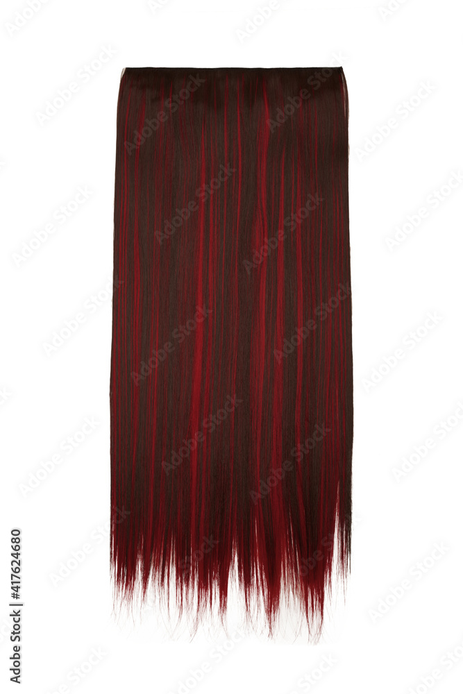 Fototapeta premium Subject shot of brown and red tresses for hair extension. Natural looking strands are isolated on the white background. 