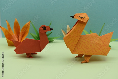 Brown origami goose. Beautiful pattern paper.